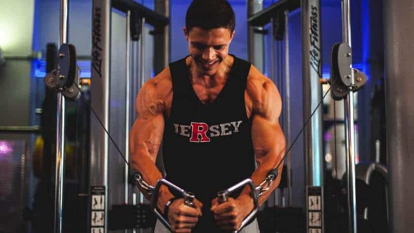 Man doing a cable chest workout.